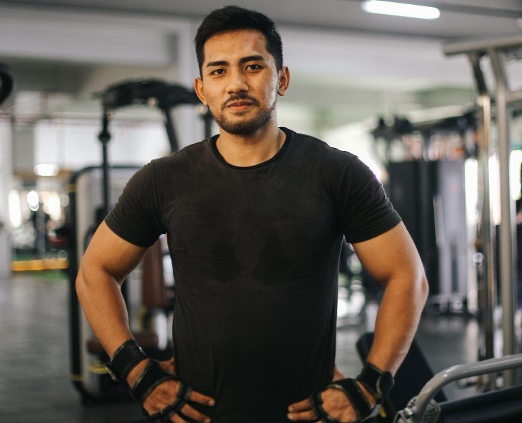 Man posing in gym